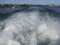 Speeding boat wake on sea