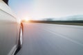 Speeding car with blurred road Royalty Free Stock Photo