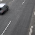 Speeding car on highway Royalty Free Stock Photo