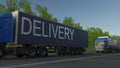 Speeding freight semi truck with DELIVERY caption on the trailer. Road cargo transportation. 3D rendering