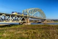 Speeding train crossing the Rhine river
