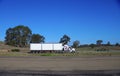 Speeding truck semi trailer on freeway in country town between Sydney and melbourne NSW Australia Royalty Free Stock Photo