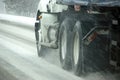 Speeding truck wheels on icy road Royalty Free Stock Photo