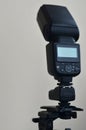 Speedlight gun with trigger set mounted on tripod Royalty Free Stock Photo