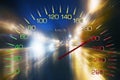 Speedometer on the background of blurry traffic of cars