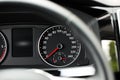 Speedometer on car dashboard, view through steering wheel Royalty Free Stock Photo