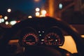 Speedometer scoring high speed in a fast motion. Sporty Car Dashboard Instruments illuminated at night. Rev counter Royalty Free Stock Photo