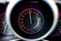 Speedometer shows a dangerously high speed. Dashboard with motion blur effect of car going fast. High speed concept Royalty Free Stock Photo