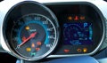 Speedometer and tachometer with additional instruments on car dash Royalty Free Stock Photo