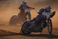 Speedway riders compete on track in Pardubice, Czech Republic.