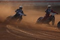 Speedway riders compete on track in Pardubice, Czech Republic.