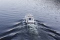 Speedy luxury white motor boat on the water surface