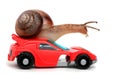 Speedy snail like car racer. Concept of speed and success. Wheels are blur because of moving. Isolated white background