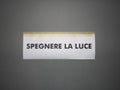 Spegnere la luce sign (translation: Turn outwall the light) sign Royalty Free Stock Photo