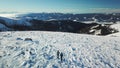 Speikkogel - A drone shot of a couple wearing snow shoes hiking up to Amerinkogel's peak in Austrian Alps. Fresh powder snow Royalty Free Stock Photo