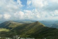 Speikkogel - A panoramic view on the distant Grosse Speikkogel in Austrian Alps. The mountains around are lush green.