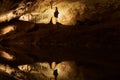 Speleologist Hanging On A Rope In A Cave Royalty Free Stock Photo