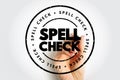 SPELL CHECK displayed in a circular stamp with worn detailing, drawn over a hand holding a marker, emphasizing proofreading, Royalty Free Stock Photo