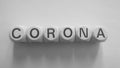 Spelling of corona using wooden dice Royalty Free Stock Photo
