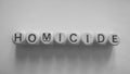 Spelling of homicide using wooden dice