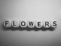 Word flowers spelled on dice Royalty Free Stock Photo
