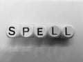 Spelling of spell using wooden dice Royalty Free Stock Photo