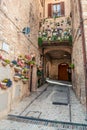 Traditional italian medieval alley and buildings in the historic center of beautiful town of Spello, in Umbria Region, Italy Royalty Free Stock Photo