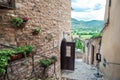 Traditional italian medieval alley and buildings in the historic center of beautiful town of Spello, in Umbria Region, Italy Royalty Free Stock Photo