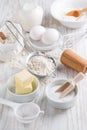 Spelt flour, sugar with baking ingredients and kitchen utensils