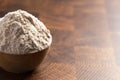 Spelt Flour in a Wooden Bowl on a Wooden Butchers Block Royalty Free Stock Photo