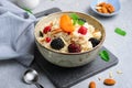 Spelt Porridge with Fruits, Berries, and Nut Topping, Healthy Breakfast or Snack