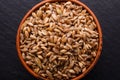 Spelt seeds on a dark stone background