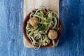 Spelt tagliatelle with vegan meatballs and kale