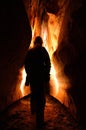 Spelunker exploring a cave Royalty Free Stock Photo