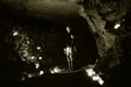 Spelunkers standing in chamber in abandoned mine in Wiltshire, UKMan and child underground in an abandoned mine Royalty Free Stock Photo