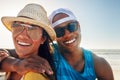 Spend summer with the people youll never forget. Portrait of a young couple sitting on the beach on a sunny day. Royalty Free Stock Photo