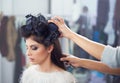 Spending a day in the stylists chair. A young woman at a hair salon having her done. Royalty Free Stock Photo