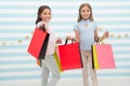 Spending great time together. Children satisfied shopping striped background. Obsessed with shopping and clothing malls