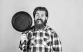 Spending nice time at home. housekeep husband cook in pot. mature chef in checkered shirt. prepare meal food at home Royalty Free Stock Photo