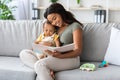 Spending Time With Baby. Loving Black Mother Reading Book To Infant Child Royalty Free Stock Photo