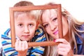 Mother and son play with empty frame.