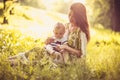 Spending time with Mommy at nature. Baby boy. Royalty Free Stock Photo