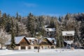 Spending winter holidays concept in idyllic wooden house in snowfall beside lake, Kranjska Gora, Slovenia