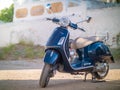 SPETSES, GREECE - 2019: a parked blue vespa