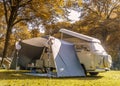 Speulderbos Veluwe Netherlands October 2017,Hipster retro minni van in the autumn forest, , retro camping car, minu bus Royalty Free Stock Photo