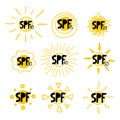 SPF sun set. Hand drawn doodle solar symbols, uv protection emblem labels, yellow sings with black letters and numbers, icons for Royalty Free Stock Photo