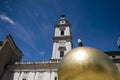 Sphaera, statue of a man on a golden globe on the Kapitelplatz i