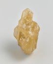 Yellow sphalerite ore on white background.