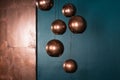 Sphere bronze lamps with turquoise backdrop