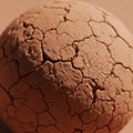 A sphere with a cracked dry clay surface resembling parched earth Royalty Free Stock Photo